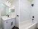 Modern bathroom with white cabinets and marble shower at 3088 Sire Trl, Lakeland, FL 33811