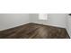 Simple bedroom with dark laminate flooring at 3088 Sire Trl, Lakeland, FL 33811