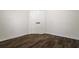 Simple bedroom with double doors and dark brown flooring at 3088 Sire Trl, Lakeland, FL 33811