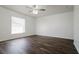 Spacious bedroom with dark laminate flooring and ceiling fan at 3088 Sire Trl, Lakeland, FL 33811