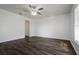 Spacious bedroom with dark laminate flooring and ceiling fan at 3088 Sire Trl, Lakeland, FL 33811