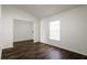Bright bedroom with window and dark brown flooring at 3088 Sire Trl, Lakeland, FL 33811