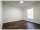 Bright bedroom with dark wood floors and window blinds at 3088 Sire Trl, Lakeland, FL 33811