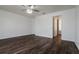 Bright bedroom with laminate wood floor and ceiling fan at 3088 Sire Trl, Lakeland, FL 33811