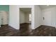 Open entryway with dark brown wood-look flooring at 3088 Sire Trl, Lakeland, FL 33811