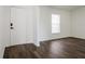 Bright entryway with hardwood floors and a white door at 3088 Sire Trl, Lakeland, FL 33811