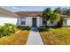 Front entrance of a home with walkway and landscaping at 3088 Sire Trl, Lakeland, FL 33811