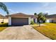 One-story house with brown roof, attached garage, and a well-maintained lawn at 3088 Sire Trl, Lakeland, FL 33811