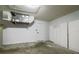 Garage with extra storage cabinets and AC unit at 3088 Sire Trl, Lakeland, FL 33811