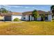 One-story house with brown roof and gray garage door at 3088 Sire Trl, Lakeland, FL 33811