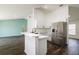 Modern kitchen with white cabinets, stainless steel appliances and a large island at 3088 Sire Trl, Lakeland, FL 33811