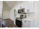 Modern kitchen with stainless steel appliances and white cabinetry at 3088 Sire Trl, Lakeland, FL 33811