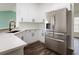 Modern kitchen with stainless steel appliances and white cabinetry at 3088 Sire Trl, Lakeland, FL 33811