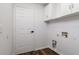 Laundry room with white cabinets and vinyl flooring at 3088 Sire Trl, Lakeland, FL 33811