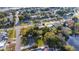 Aerial view showcasing home and neighborhood near lake at 5883 Dogwood Dr, Orlando, FL 32807