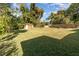 Large backyard with grassy lawn and shed at 5883 Dogwood Dr, Orlando, FL 32807