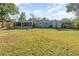 Spacious backyard with grassy area and wooden fence at 5883 Dogwood Dr, Orlando, FL 32807