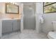 Bathroom with gray vanity, tile flooring, and a shower at 5883 Dogwood Dr, Orlando, FL 32807