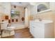 Bathroom features updated vanity, tile flooring, and a tub at 5883 Dogwood Dr, Orlando, FL 32807