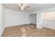 Bright bedroom with ceiling fan and wood-look vinyl flooring at 5883 Dogwood Dr, Orlando, FL 32807