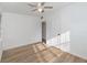 Bright bedroom with wood-look floors and ceiling fan at 5883 Dogwood Dr, Orlando, FL 32807