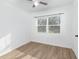 Bedroom featuring wood-look floors and a window with blinds at 5883 Dogwood Dr, Orlando, FL 32807