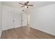 Spacious bedroom with ceiling fan and vinyl flooring at 5883 Dogwood Dr, Orlando, FL 32807