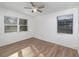 Bright bedroom with two windows and vinyl flooring at 5883 Dogwood Dr, Orlando, FL 32807