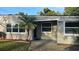 Front view of a single story home with landscaping at 5883 Dogwood Dr, Orlando, FL 32807