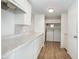 Laundry room with white cabinets and vinyl flooring at 5883 Dogwood Dr, Orlando, FL 32807