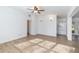 Open living area with kitchen access and wood-look floors at 5883 Dogwood Dr, Orlando, FL 32807
