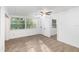 Spacious living room with vinyl flooring and lots of natural light at 5883 Dogwood Dr, Orlando, FL 32807