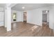 Spacious living area with wood-look floors and access to patio at 5883 Dogwood Dr, Orlando, FL 32807