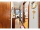 Long hallway with wood floors and vintage decor at 15220 Nw 41St Ter, Reddick, FL 32686