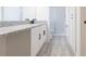 Bathroom with granite countertop, white cabinets, and walk-in shower at 50989 Highway 27 # 3, Davenport, FL 33897