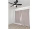 Spacious bedroom with ceiling fan and light gray curtains at 50989 Highway 27 # 3, Davenport, FL 33897