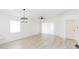 Bright living room with light wood floors and ceiling fan at 50989 Highway 27 # 3, Davenport, FL 33897