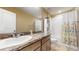 Clean bathroom with a shower/tub and a patterned curtain at 1076 Sugarwood St, Davenport, FL 33837