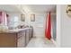Clean bathroom with double vanity and a shower/tub combo at 1076 Sugarwood St, Davenport, FL 33837