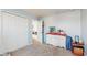 Bedroom with double door closet and view into another room at 1076 Sugarwood St, Davenport, FL 33837