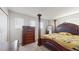 Elegant bedroom with a king-size bed and beautiful wooden furniture at 1076 Sugarwood St, Davenport, FL 33837