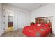 Bedroom with a double bed, wooden dresser and en-suite bathroom at 1076 Sugarwood St, Davenport, FL 33837