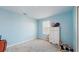 Cozy bedroom with dresser and closet, light blue walls at 1076 Sugarwood St, Davenport, FL 33837