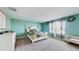 Spacious bedroom with a queen-size bed and plenty of closet space at 1076 Sugarwood St, Davenport, FL 33837