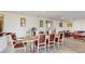 Dining area with rustic wooden table and leather chairs at 1076 Sugarwood St, Davenport, FL 33837