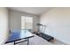 Room includes a ping pong table and treadmill at 1076 Sugarwood St, Davenport, FL 33837