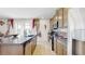 Island kitchen features granite countertops and stainless steel appliances at 1076 Sugarwood St, Davenport, FL 33837