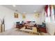 Living room features leather armchairs, a sofa, and a coffee table at 1076 Sugarwood St, Davenport, FL 33837