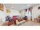 Spacious living room with leather furniture and decorative accents at 1076 Sugarwood St, Davenport, FL 33837