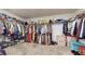 Large walk-in closet with ample hanging and shelving space at 1076 Sugarwood St, Davenport, FL 33837